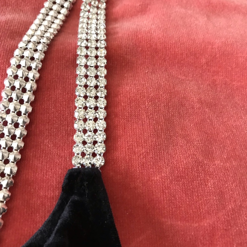 Black bodysuit with rhinestone straps